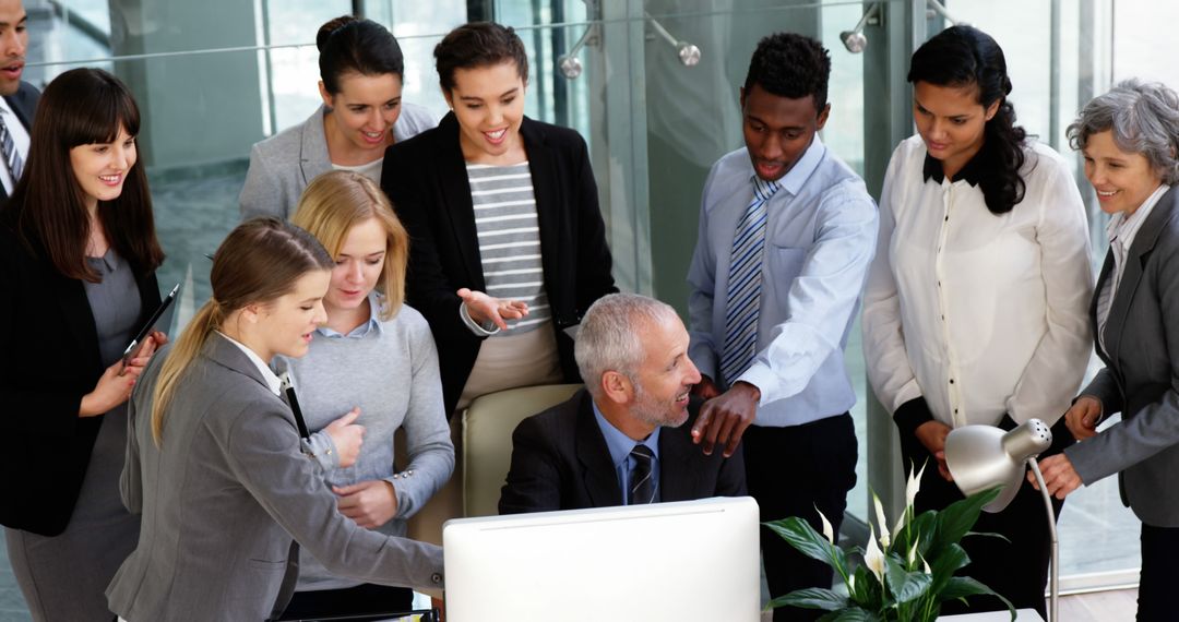 Diverse Team Collaborating Around Office Desk