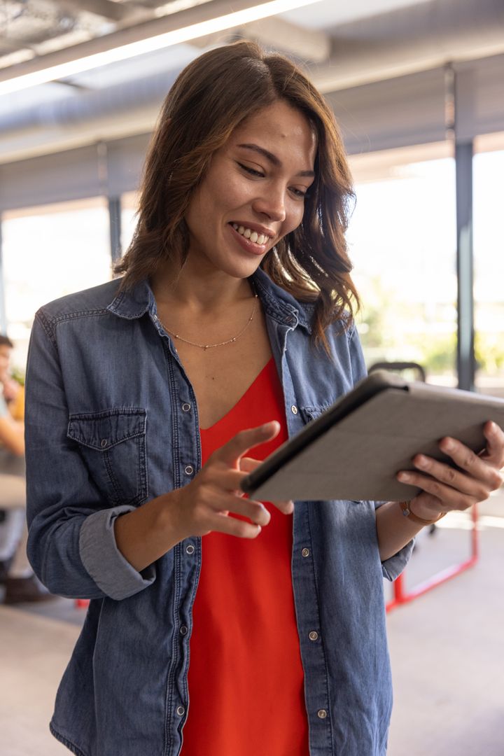 Professional Woman Engaging with Tablet in Contemporary Office