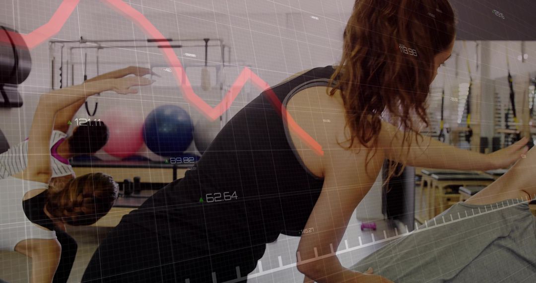 Pilates Enthusiast Reaching and Stretching in Studio