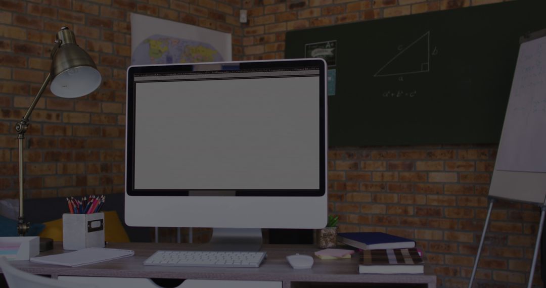 Modern Workspace with Computer Screen and Office Supplies