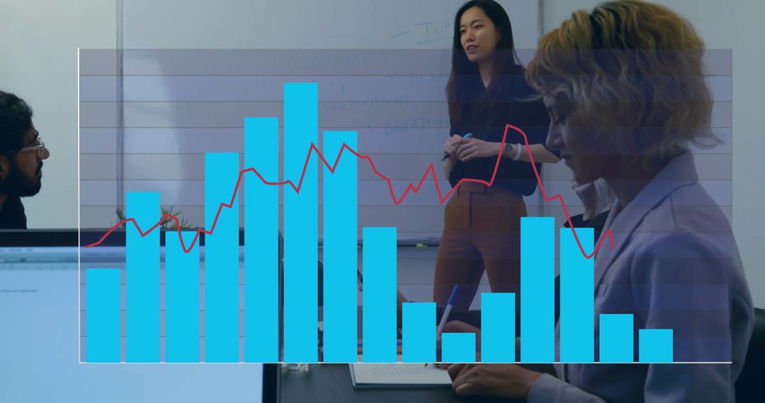 Team Engaged in Data Analysis with Overlay Charts