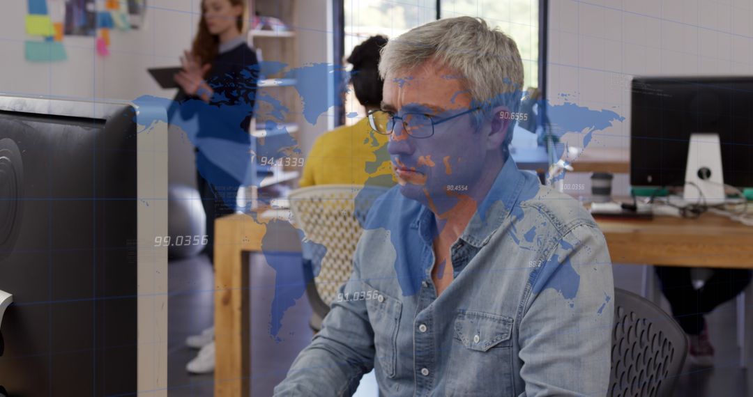 Senior Analyzing Global Data on Computer in Modern Office Environment