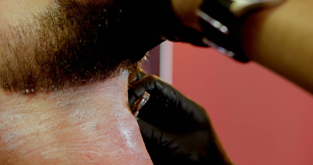 Close-Up of Barber Trimming Beard with Electric Clipper - Free Images, Stock Photos and Pictures on Pikwizard.com