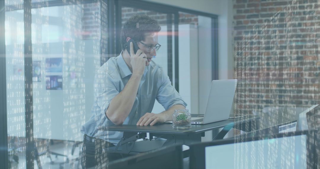 Businessman Utilizing Technology in Modern Office with Digital Overlay