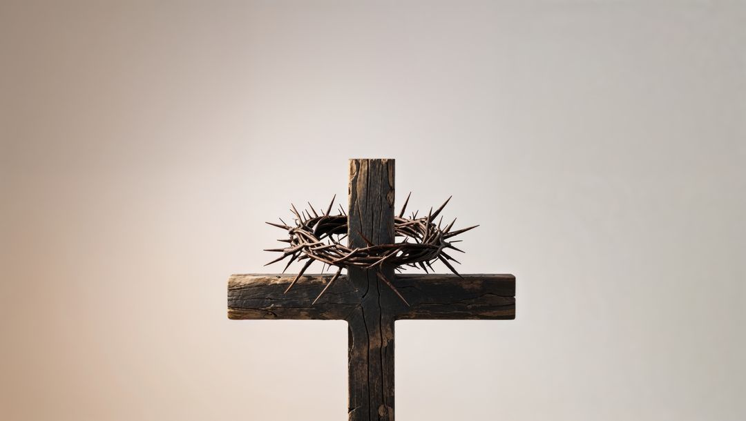 Rustic wooden cross with crown of thorns symbolizing jesus' sacrifice