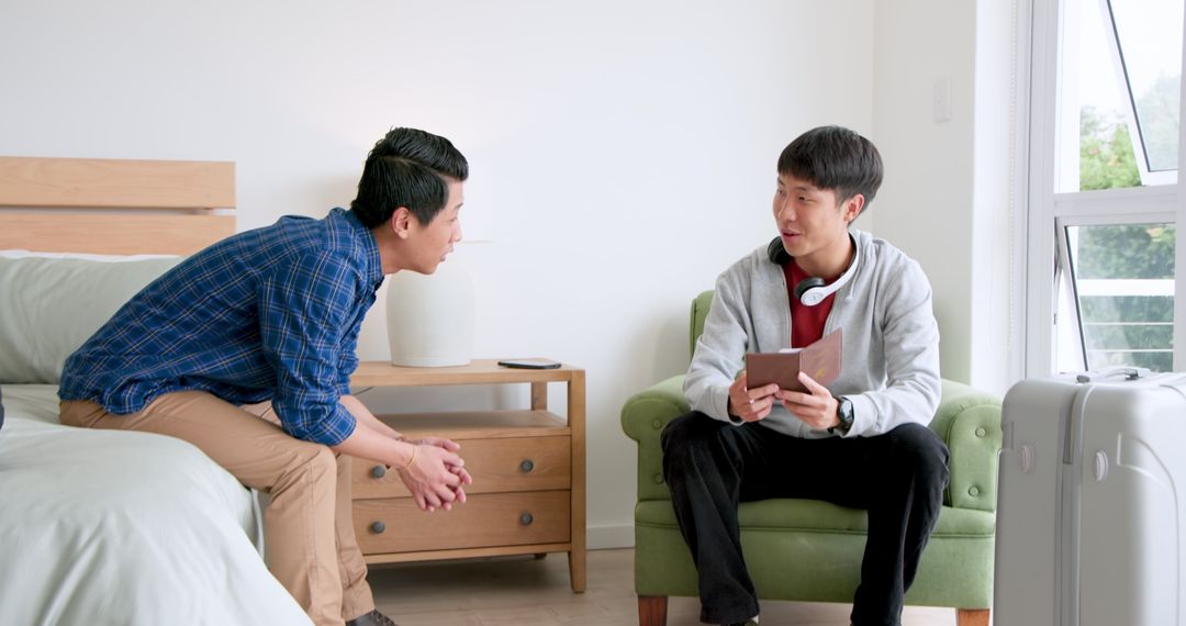 Two Friends Engaging in Warm Conversation at Home