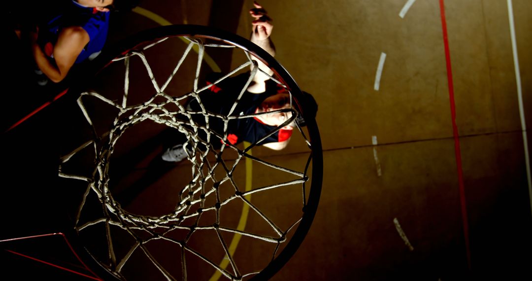 Aerial View of Basketball Hoop with Player Attempting Shot - Free Images, Stock Photos and Pictures on Pikwizard.com