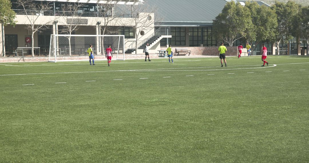 School Team Soccer Practice on Green Field