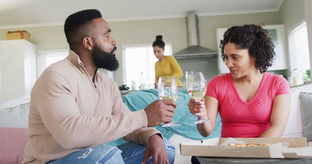 Couple Enjoying Wine and Pizza at Home - Free Images, Stock Photos and Pictures on Pikwizard.com