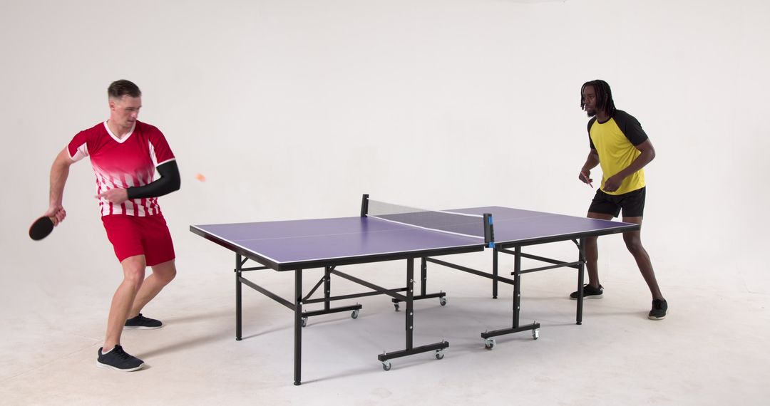 Players in Action During Intense Table Tennis Match