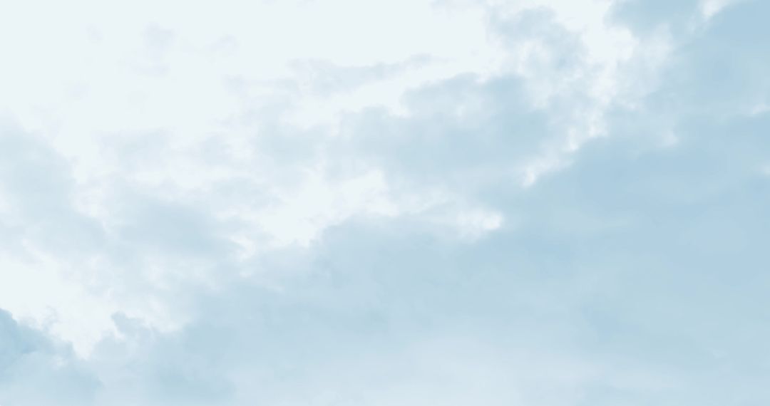 Fluffy White Clouds in Fast Motion Across Blue Sky