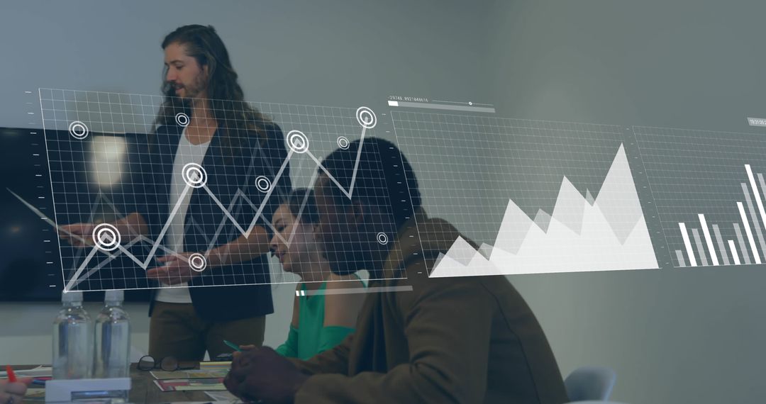 Business Team Analyzing Data with Graphs in Office Meeting - Free Images, Stock Photos and Pictures on Pikwizard.com