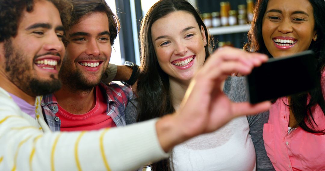 Friends Smiling and Taking Selfie Together Indoors - Free Images, Stock Photos and Pictures on Pikwizard.com