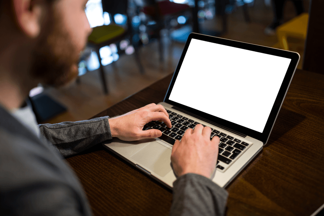 Transparent Businessman Typing on Laptop in Relaxed Cafeteria Ambiance