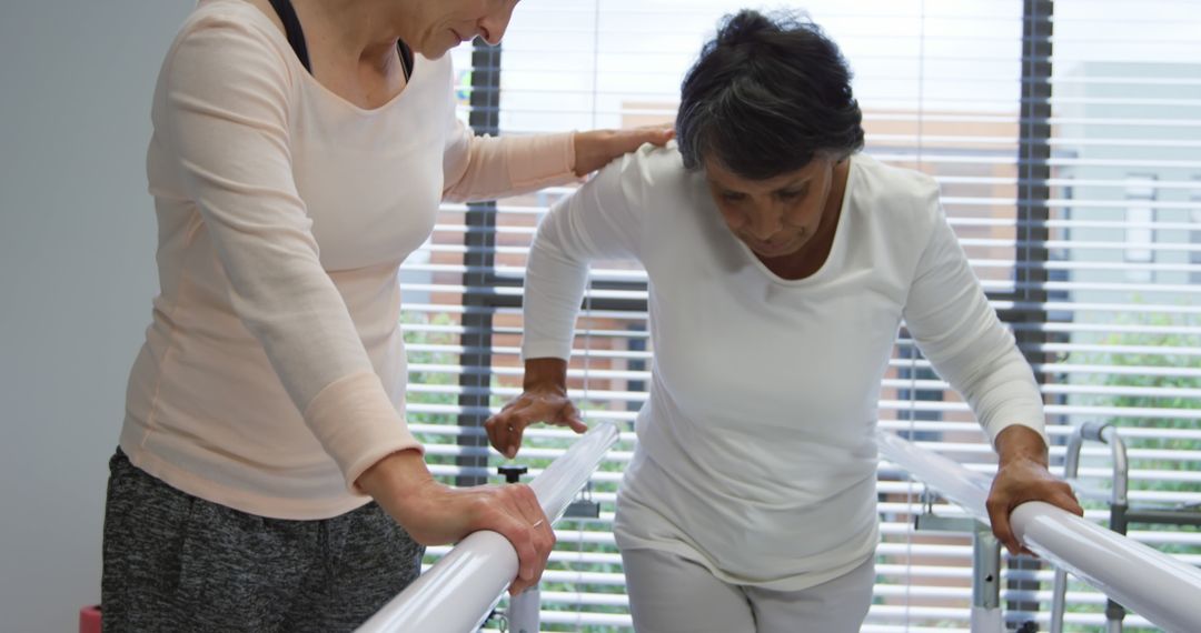 Physical Therapist Assisting Senior Woman During Rehab Session - Free Images, Stock Photos and Pictures on Pikwizard.com