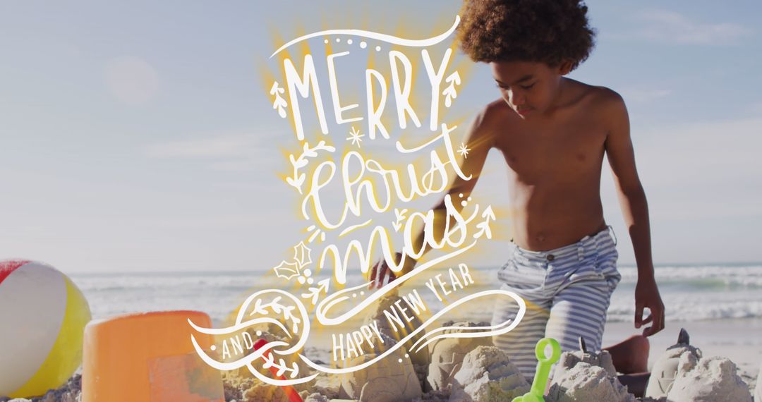 Christmas Greeting with Boy Building Sandcastles on Beach