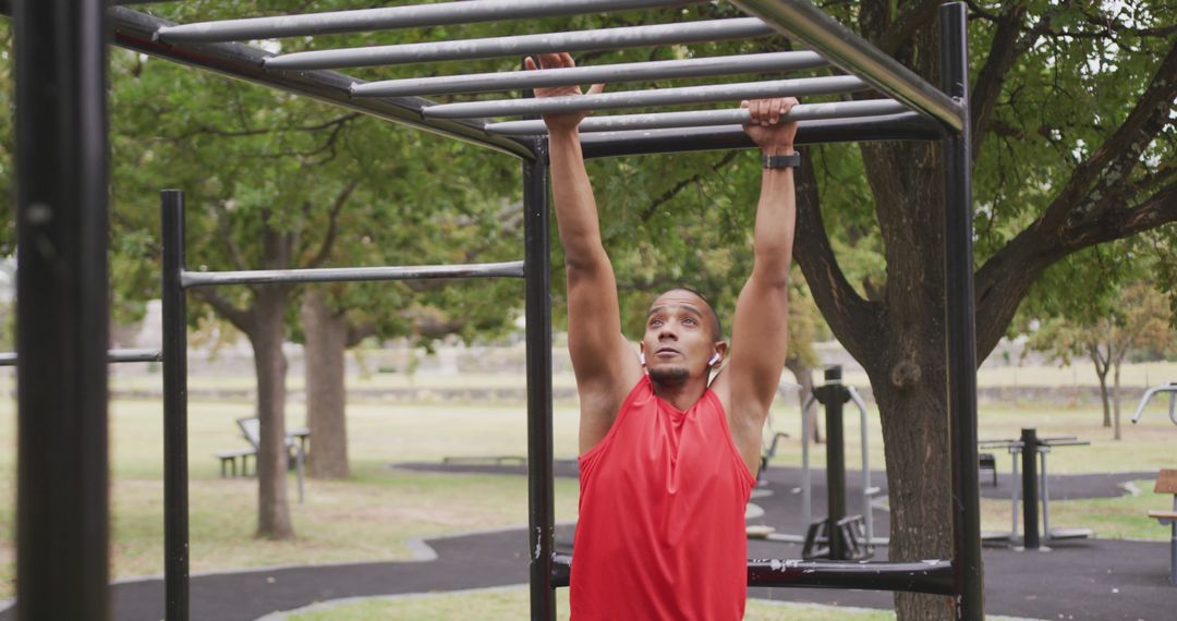 Young African American Man Exercising on Monkey Bars in Outdoor Gym - Free Images, Stock Photos and Pictures on Pikwizard.com