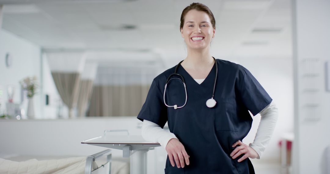 Confident Nurse in Hospital Setting Standing and Smiling - Free Images, Stock Photos and Pictures on Pikwizard.com