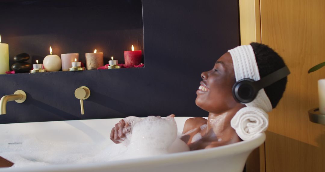 Relaxing Woman in Bathtub with Candles and Headphones - Free Images, Stock Photos and Pictures on Pikwizard.com