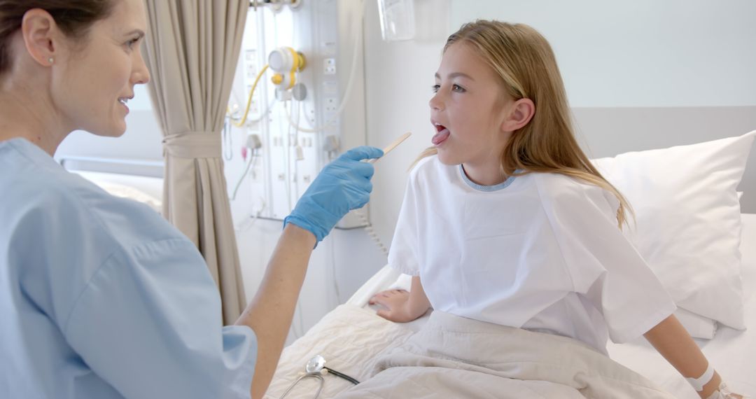 Female Doctor Examining Young Girl Patient in Hospital Bed - Free Images, Stock Photos and Pictures on Pikwizard.com