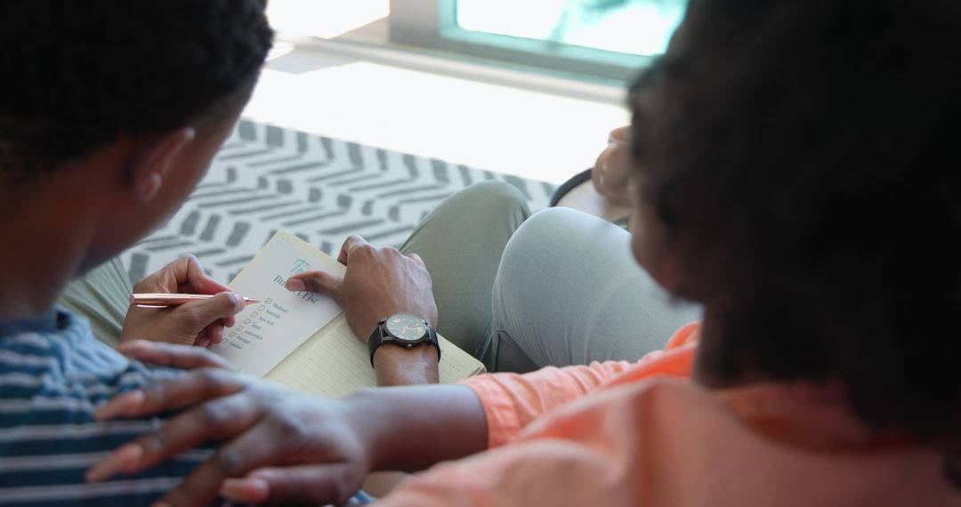 Couple Relaxing Indoors Reading and Connecting