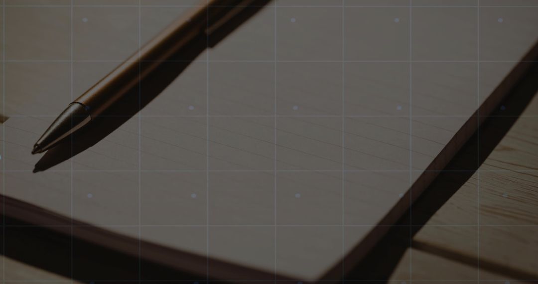 Metallic Ballpoint Pen on Lined Notebook in Minimal Workspace