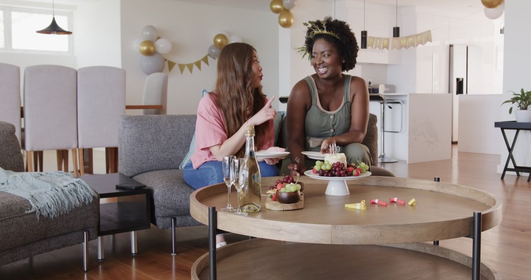 Joyful Lesbian Couple Celebrating Birthday at Home