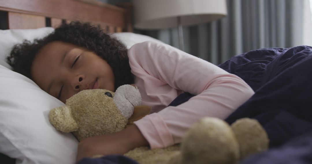 Child Sleeping Peacefully with Teddy Bear in Cozy Bed - Free Images, Stock Photos and Pictures on Pikwizard.com