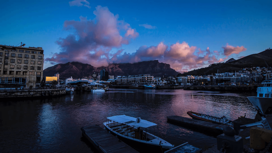 Serene Waterfront with Architecture and Skyscrapers Reflected in Transparent Lake at Dusk