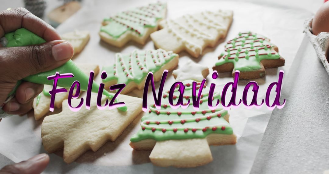 Hand Decorating Holiday Cookies with Feliz Navidad Message