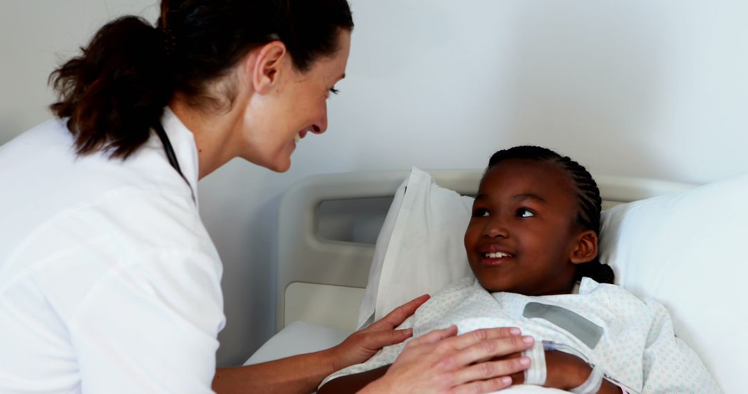 Smiling Nurse Comforting Young African American Patient in Hospital Bed - Free Images, Stock Photos and Pictures on Pikwizard.com