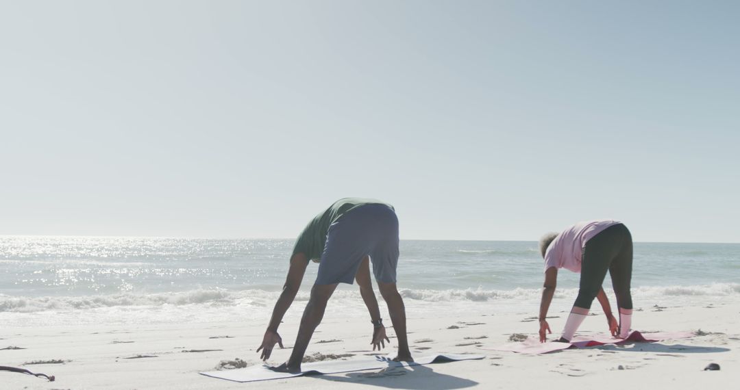 Two People Practicing Yoga on Beach at Sunrise - Free Images, Stock Photos and Pictures on Pikwizard.com