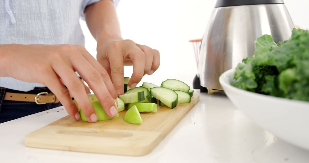 Person Chopping Fresh Vegetables on Cutting Board in Kitchen - Free Images, Stock Photos and Pictures on Pikwizard.com