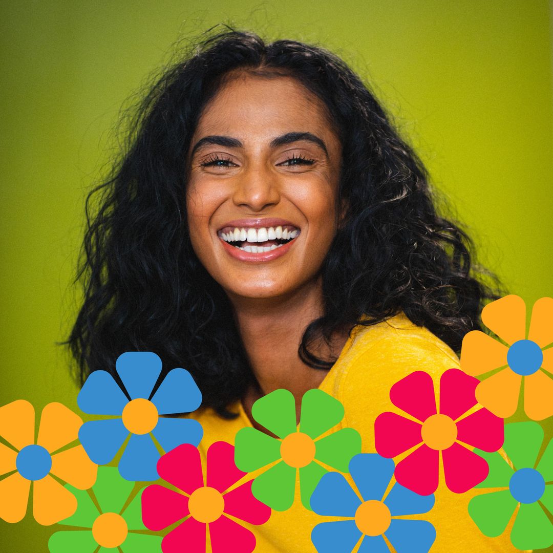 Cheerful Woman Smiling in Vibrant Floral Design