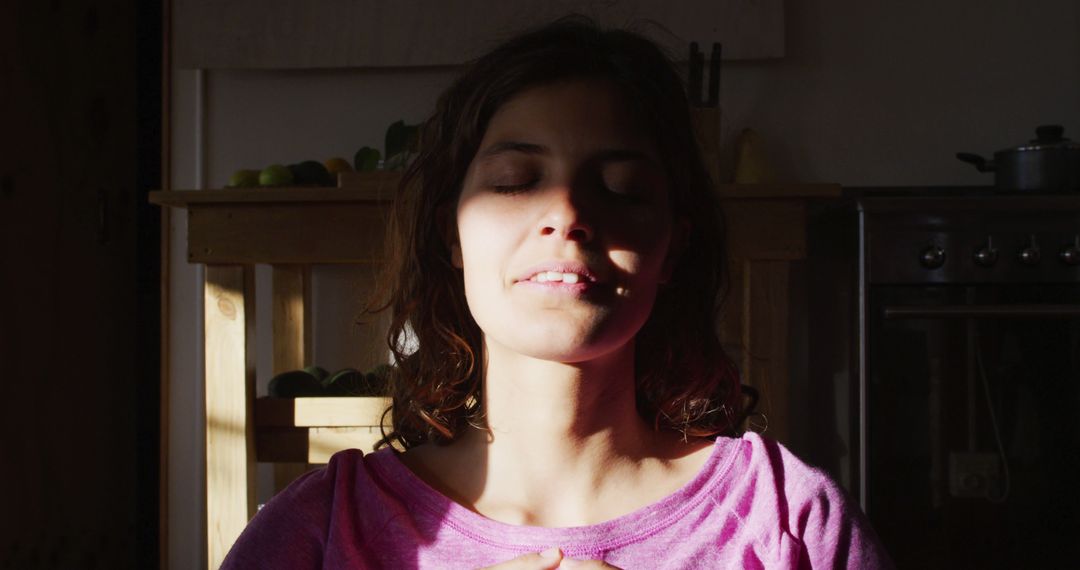 Young Woman Meditating in Peaceful Sunlit Room - Free Images, Stock Photos and Pictures on Pikwizard.com