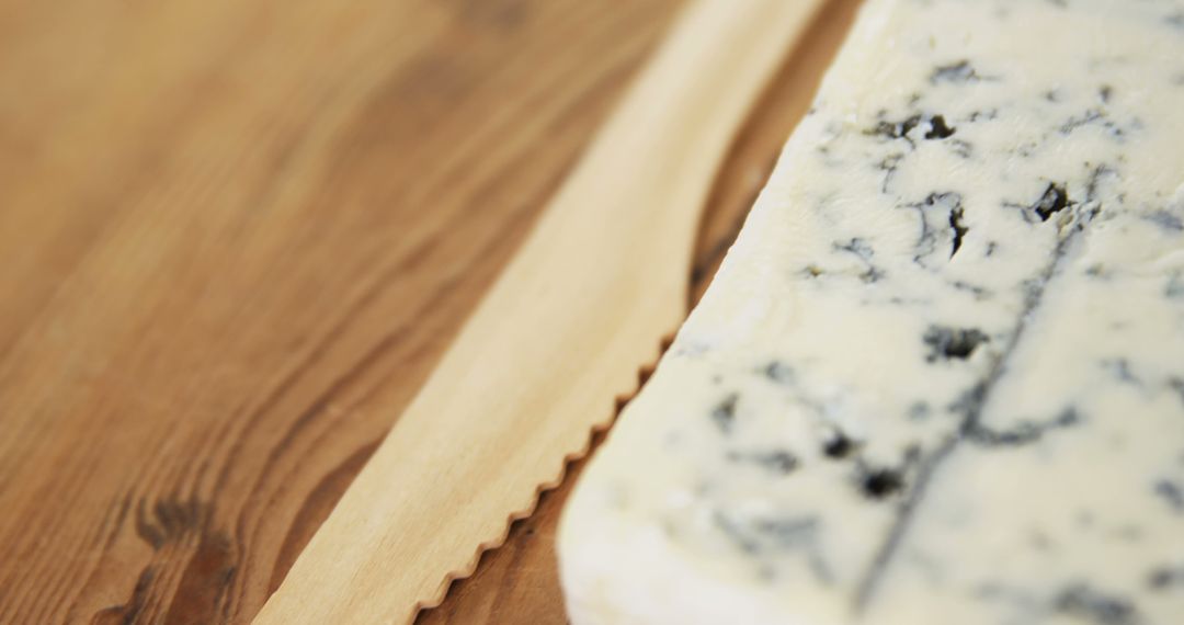 Close-Up of Blue Cheese and Wooden Cheese Knife - Free Images, Stock Photos and Pictures on Pikwizard.com