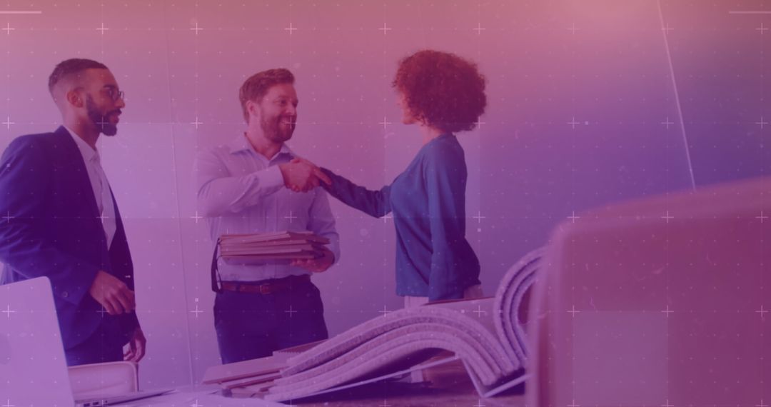 Colleagues Shaking Hands in Modern Office Setting