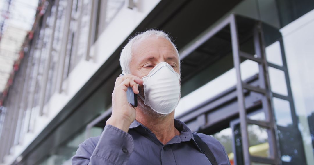 Senior Man Wearing Face Mask Talking on Phone Outdoors - Free Images, Stock Photos and Pictures on Pikwizard.com