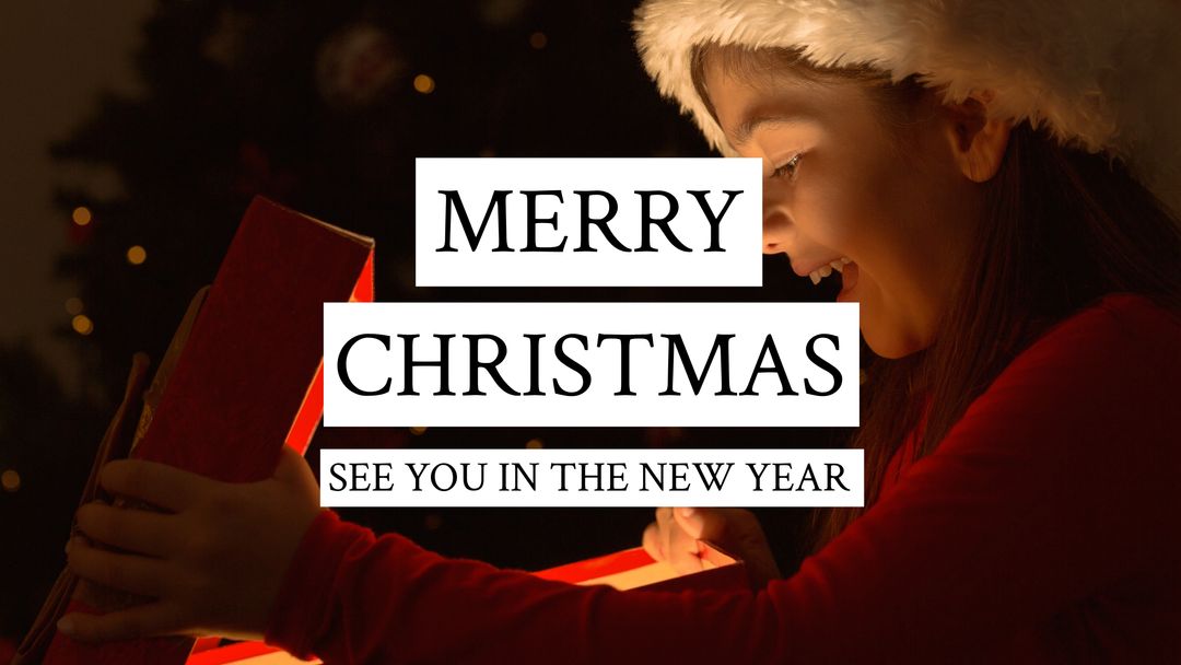 Joyful Child Opening Christmas Gift by Sparkling Tree