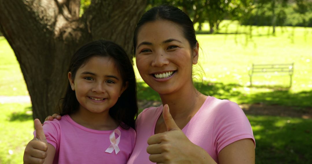 Mother and Daughter Supporting Breast Cancer Awareness - Free Images, Stock Photos and Pictures on Pikwizard.com