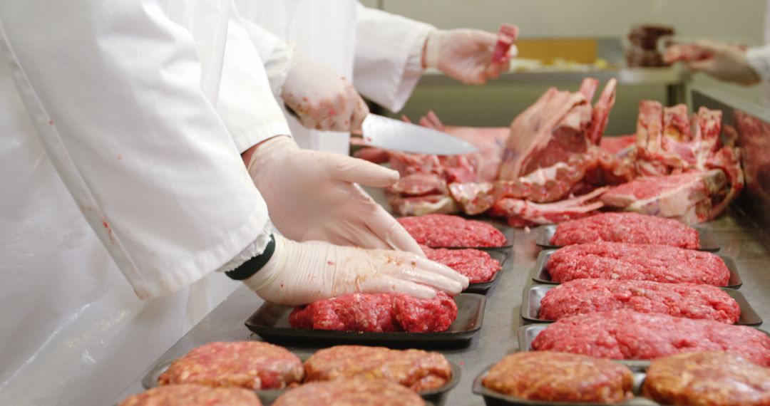 Butchers Packing Ground Beef in Industrial Kitchen - Free Images, Stock Photos and Pictures on Pikwizard.com