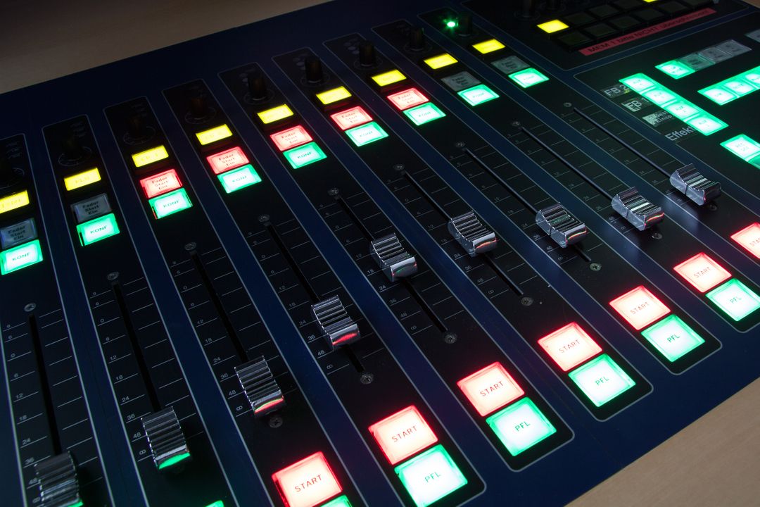 Professional Audio Mixing Console with Colorful LED Controls in Recording Studio - Free Images, Stock Photos and Pictures on Pikwizard.com