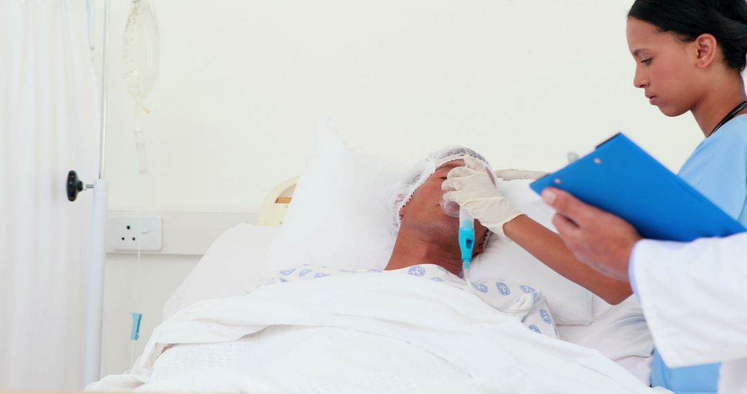 Nurse Checking Vital Signs of Patient in Hospital Bed - Free Images, Stock Photos and Pictures on Pikwizard.com