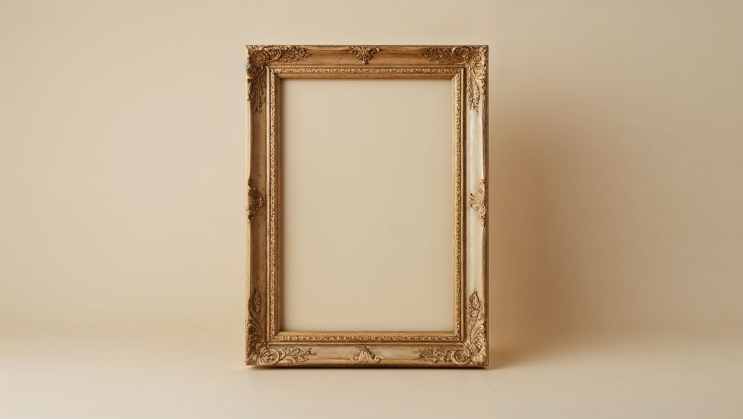 Ornate Golden Picture Frame with Antique Carved Motifs Empty on Table