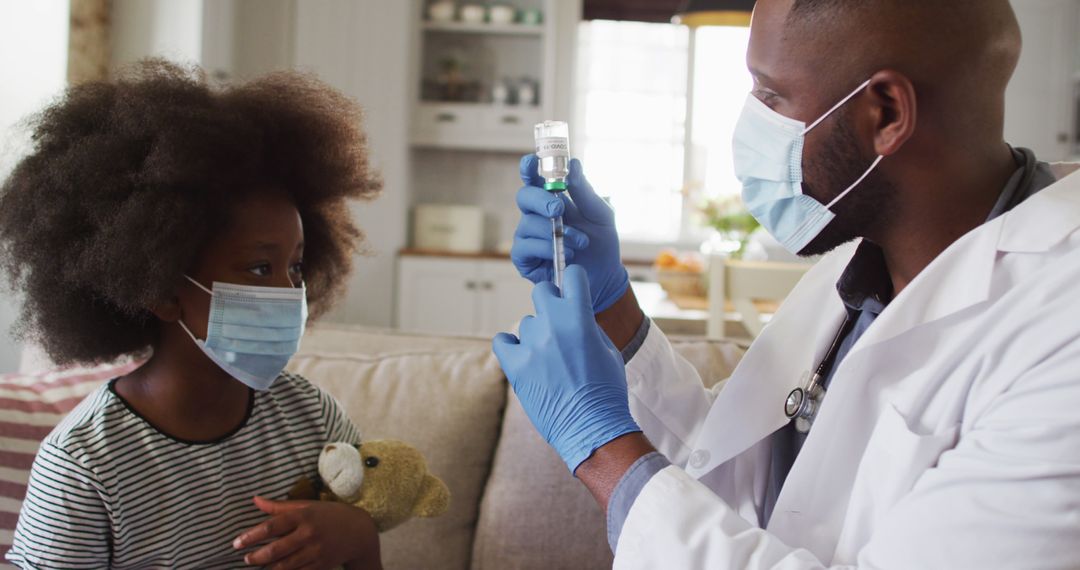 Doctor Preparing Injection While Child Watches, Both Wearing Face Masks - Free Images, Stock Photos and Pictures on Pikwizard.com