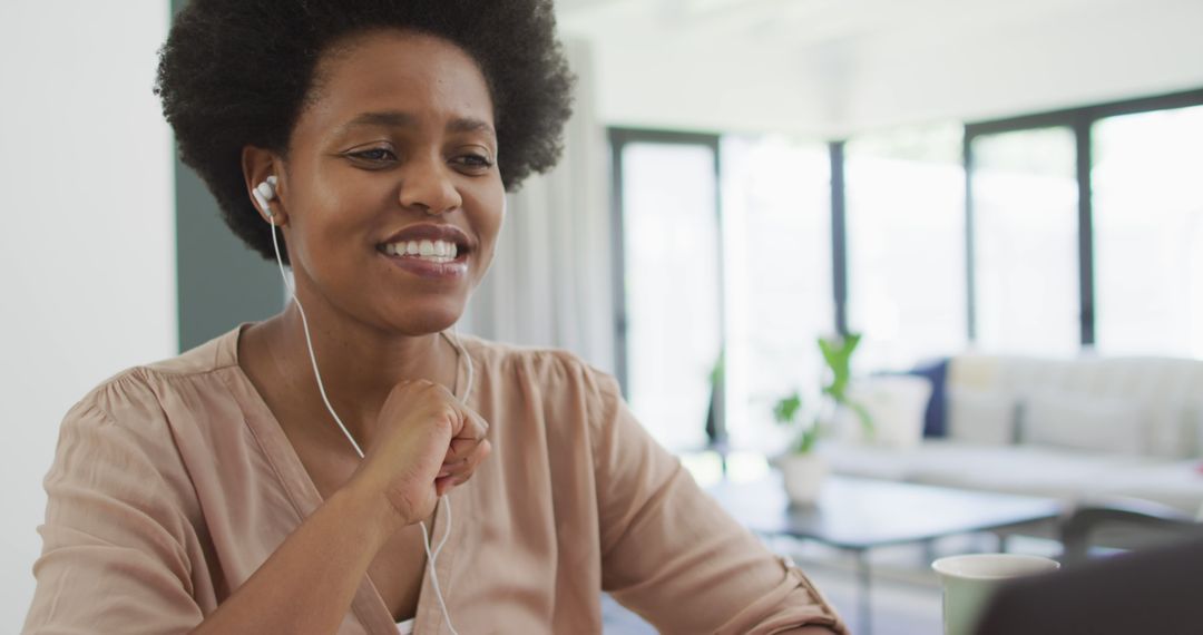 Happy Woman Using Laptop for Virtual Meeting