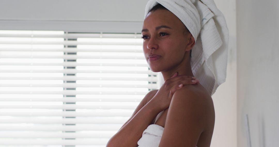 African American Woman Relaxing After Shower with Towel on Head - Free Images, Stock Photos and Pictures on Pikwizard.com