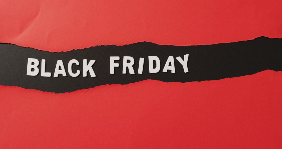 Black friday text in white on ripped black horizontal stripe on red background - Free Images, Stock Photos and Pictures on Pikwizard.com