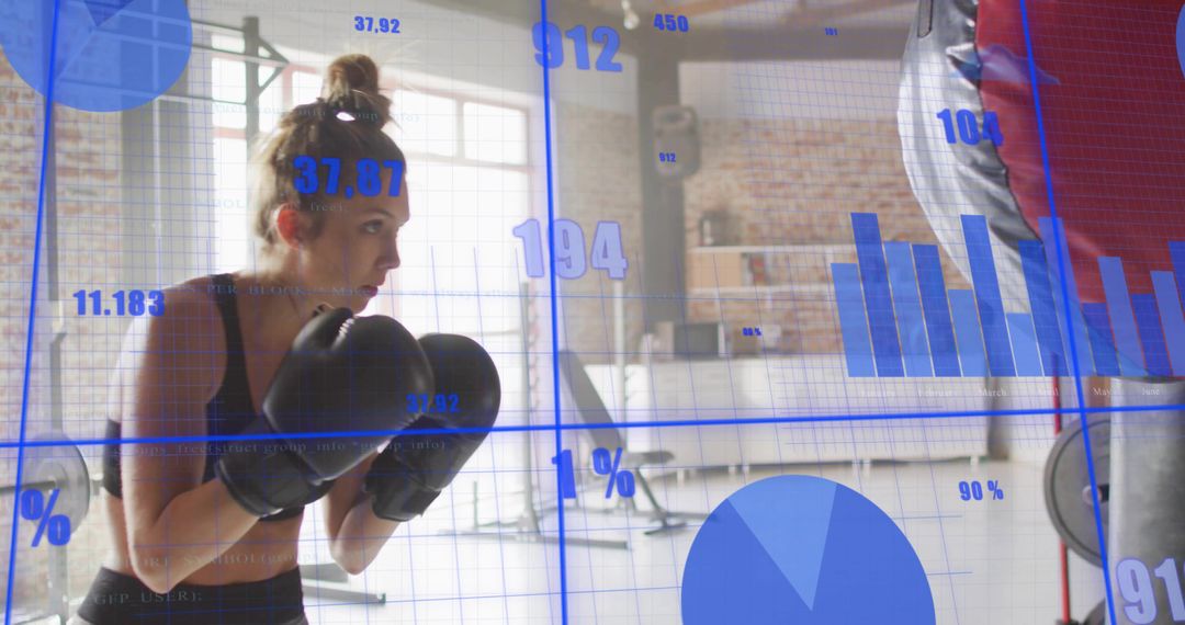 Female boxer training with fitness data overlays in loft gym for performance tracking