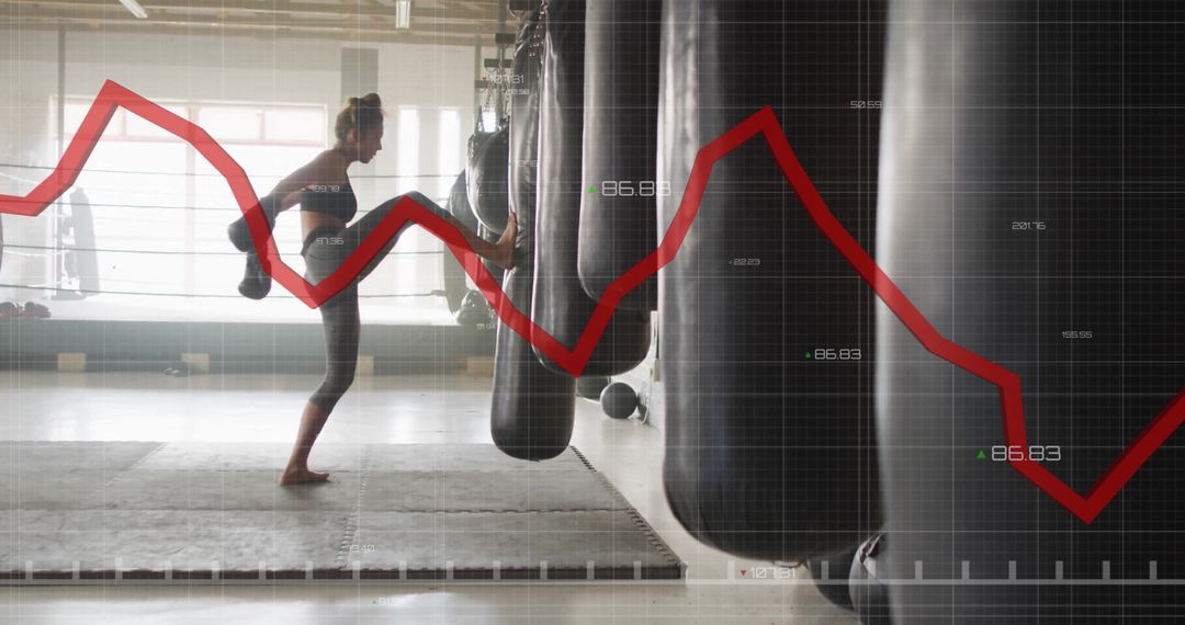 Woman Boxing with Punching Bag Over Financial Graph